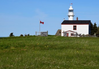 Fototapeta na wymiar Lobster Cove Head lighthouse near Rocky Harbour; scene along the Viking trail in the Gros Morne National Park, Newfoundland Canada