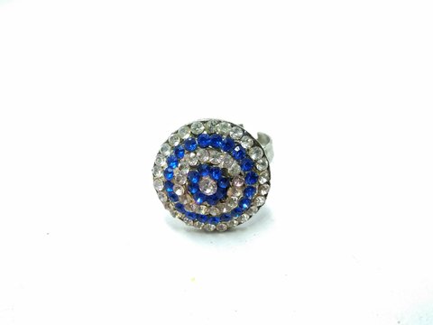 A picture of white and blue diamonds ring on white background