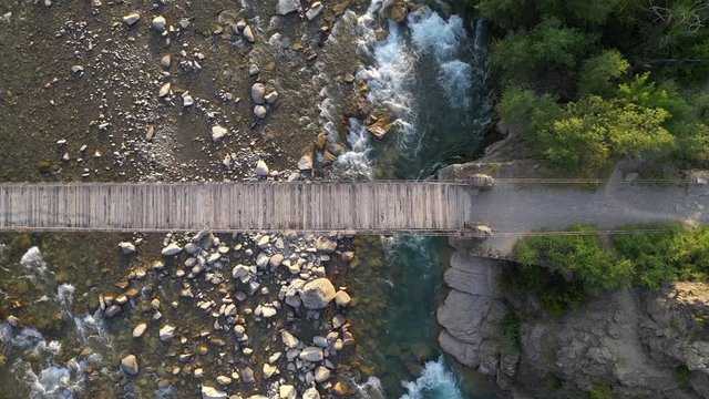 Aerial view of wooden bridge and mountain river