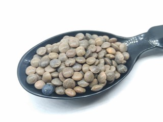  A picture of black lentil on black spoon