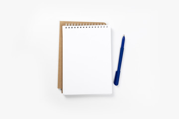 school notebook on a white background, spiral notepad on a table.