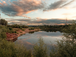 Obraz premium GOMEL, BELARUS old rusty metal river barge on the bay
