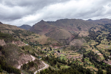 Fototapeta na wymiar View of Pisac Archaeological Park and green mountains of the Sacred Valley of the Incas, Peru