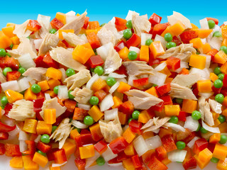  vegetables and fresh tuna sobre fondo azul. vegetables and fresh tuna on blue background.