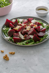 Beetroot salad with feta cheese, arugula and walnuts
