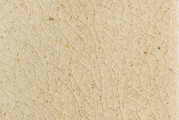 background and texture of stretch marks cracked on white cream glazed tile