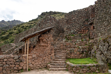 Fototapeta na wymiar Inca ruins in Pisac archeological site surrounded by green peruvian Andes mountains, Sacred valley of the Incas, Peru