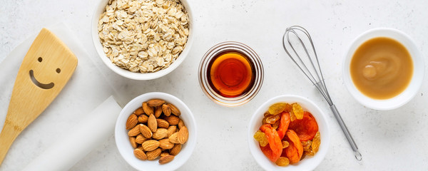 Ingredients for cooking homemade granola (muesli). Healthy breakfast.