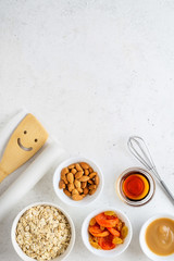Ingredients for cooking homemade granola (muesli). Healthy breakfast.