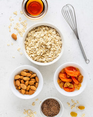 Ingredients for cooking homemade granola (muesli). Healthy breakfast.