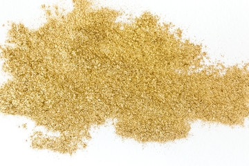 Fototapeta na wymiar Golden glitter sparkle texture on white background.