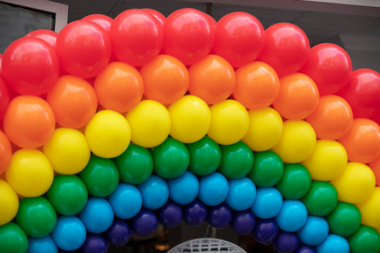 The LGBT gay pride rainbow flag background made from a collection of balloons