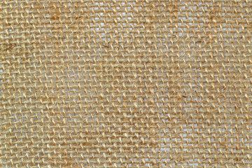 Light brown burlap texture. close-up photo in the form of a fine grid