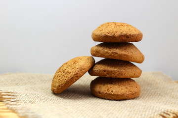 Fototapeta na wymiar Homemade oatmeal cookies laid out in a stack. It is a nutrient rich food associated with protein and fiber.