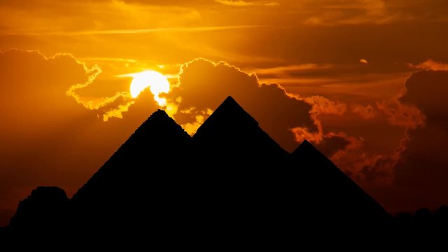 Egyptian Pyramids of Giza in Silhouette, Time Lapse at Sunset, Cairo, Egypt