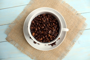 Fresh roasted coffee beans. Full cup of roasted coffee beans