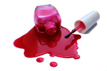 Spilled and open nail polish with a red brush