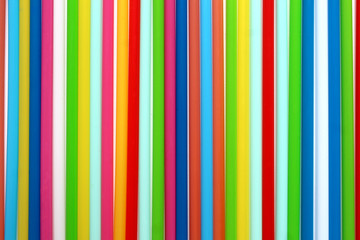 Texture of colorful plastic cocktail tubes close up