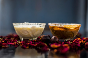 Nutmeg face mask to treat to even out discolorations and pigmentation on your face on the wooden surface consisting of Nutmeg powder, lemon juice, and curd.