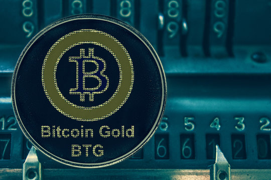 Coin Bitcoin gold btg against the numbers of the arithmometer. Crypto com chain
