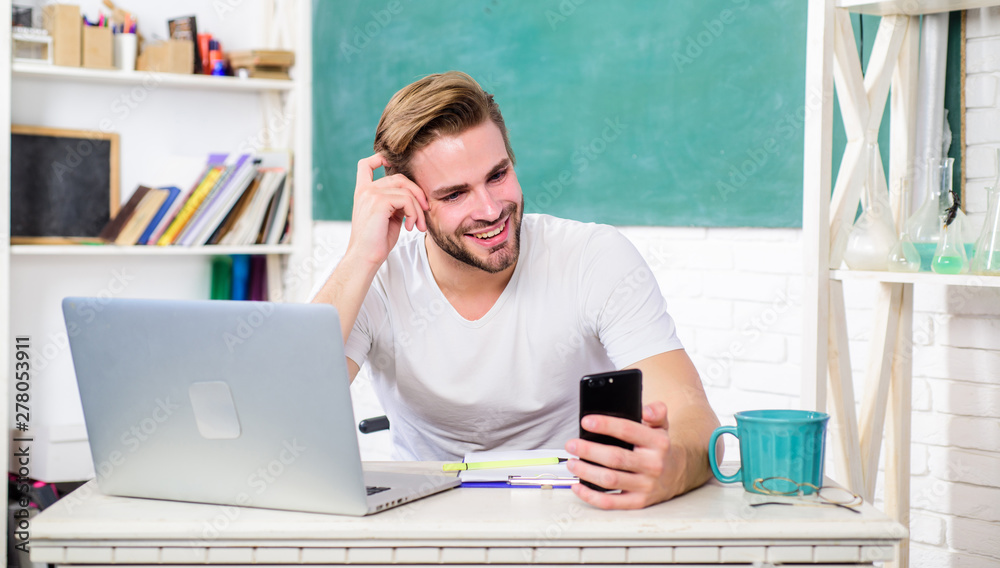 Wall mural man school teacher use modern technology for communication. web development and online communication