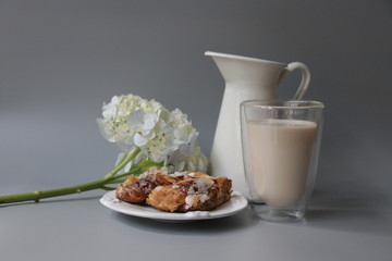 Breads in White Ceramic Bow and Traditional Cheese on Grey Background