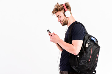 He is OK with technology. mp3 player. sexy muscular man listen music on phone mp3 player. man with...