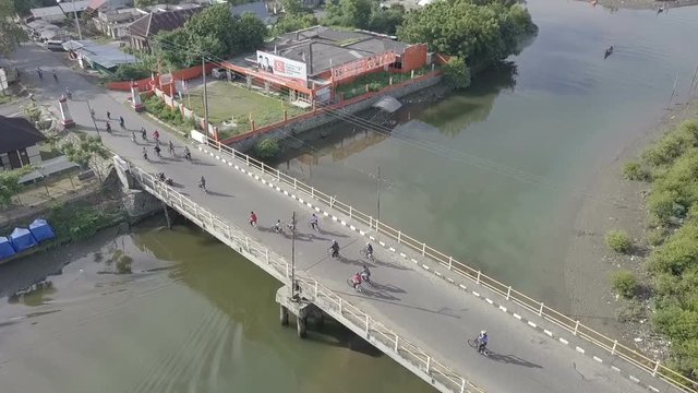 People are cycling together on Bridge