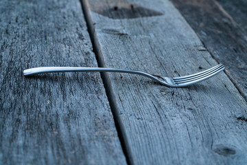 knife and fork on wooden background. Cutlery on wooden.