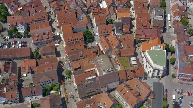 Aerial of the old part of town of Schorndorf in Germany. Zoom out with tilt down and pan to the right.