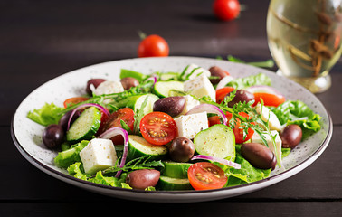 Greek salad with fresh vegetables, feta cheese and kalamata olives. Healthy food.