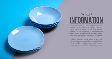 Blue empty plate on gray blue background, space for text