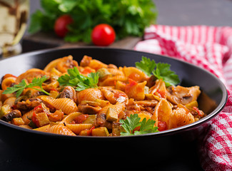 Conchiglie pasta. Italian pasta shells with mushrooms, zucchini and tomato sauce.