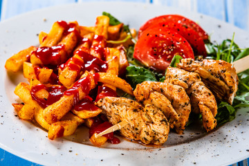 Fried chicken strips,french fries and vegetables