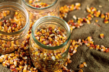 corn grain poured into glass jars
