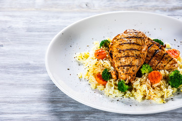 Grilled chicken fillets, rice and vegetables