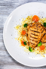 Grilled chicken fillets, rice and vegetables