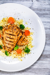 Grilled chicken fillets, rice and vegetables