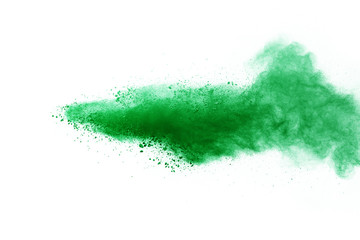 Green powder explosion on white background.