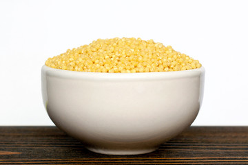 raw millet in a bowl.