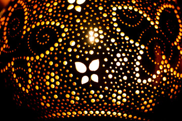 light lamp built with dried pumpkins with floral pattern