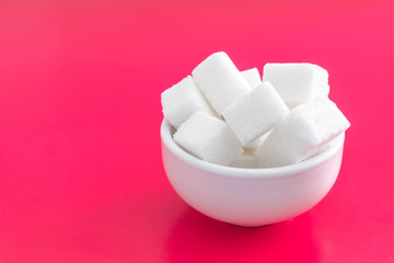pressed sugar cubes in a ceramic Cup.