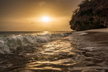 Obraz na płótnie Canvas A fantastic sunset at the beach with a bonfire and BBQ on the island of Curacaio