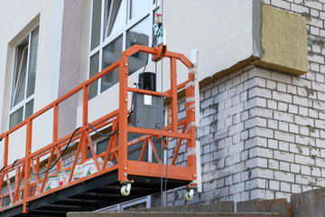 Building and Construction site of new home. Mineral wool for insulated house. House under...