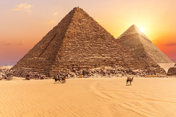 Fototapeta na wymiar The Pyramid of Menkaure and the Pyramid of Khafre in the sunset rays, Giza desert