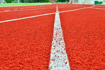 Red running track in stadium. 