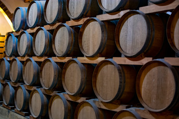 Vintage wine cellar with old oak barrels, production of fortified dry or sweet marsala wine in Marsala, Sicily, Italy