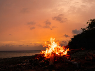 A fantastic sunset at the beach with a bonfire and BBQ on the island of Curacaio