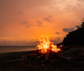 A fantastic sunset at the beach with a bonfire and BBQ on the island of Curacaio