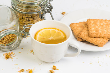 cup of  chamomile and dried flowers 